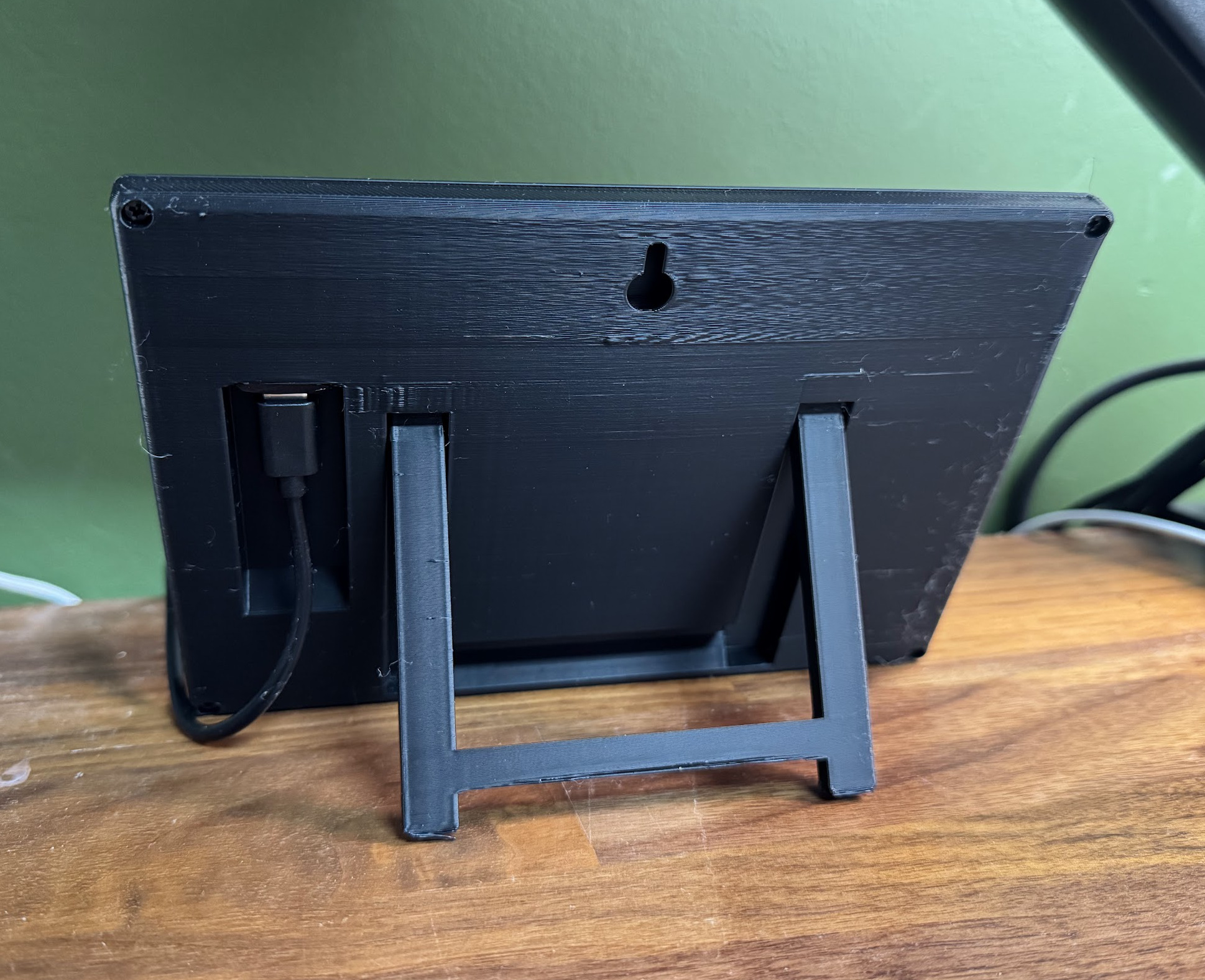 A slim e-ink frame with a 3D-printed kickstand