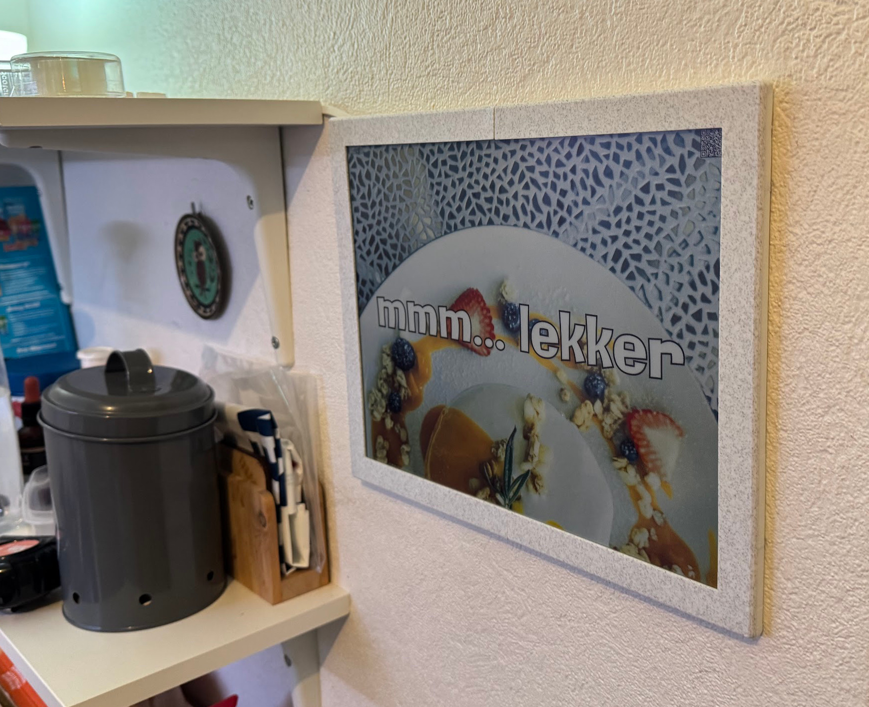 13.3 inch Spectra 6 e-ink panel in a 3D-printed case on a wall